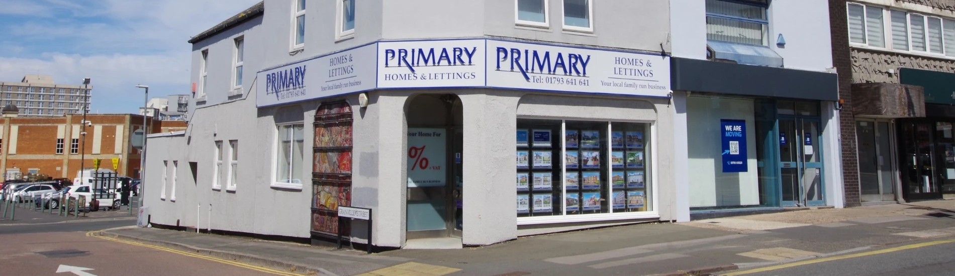 Primary Homes logo with Dawn and Dean (Business Partners) standing in front