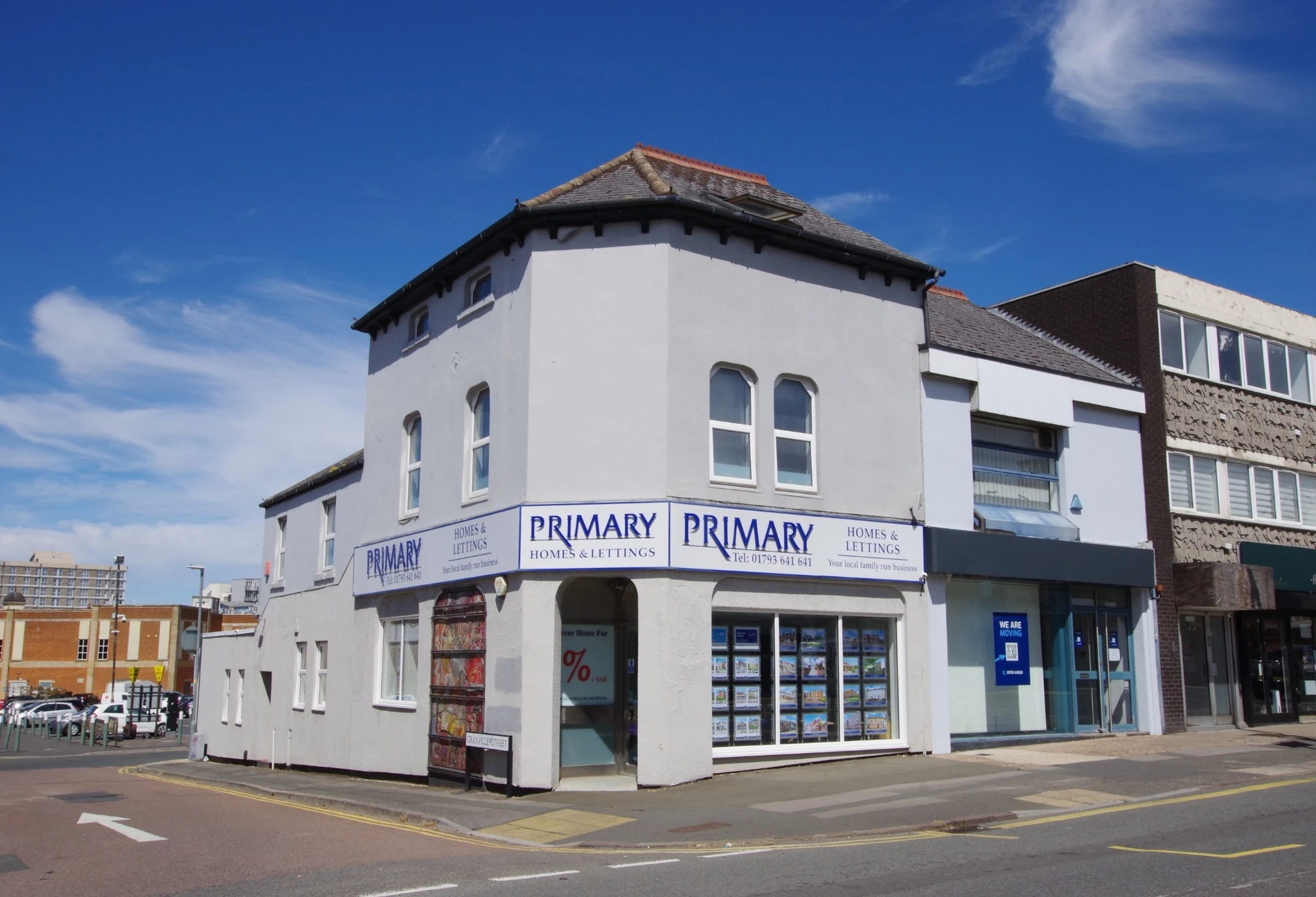 Primary Homes logo with Dawn and Dean (Business Partners) standing in front